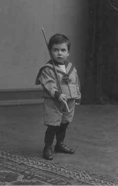 Very young boy in his sailor suit.