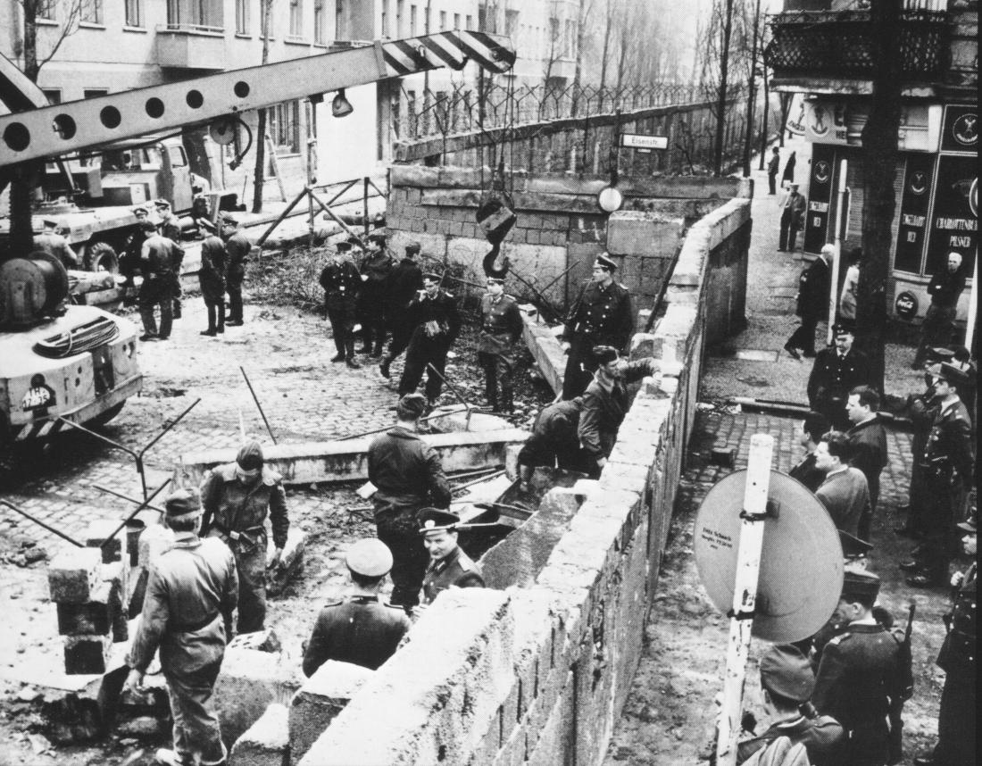 The Berlin Wall under construction.