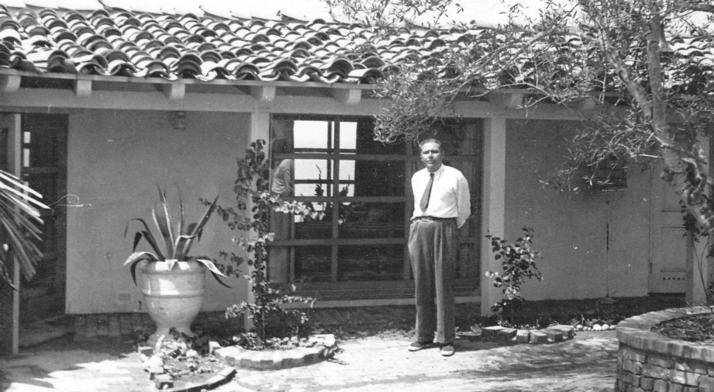 Ilonka's grandfather stands in front of the home she grew up in in La Jolla, CA.