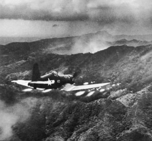 F4U Corsair over Rabaul, all guns ablaze.