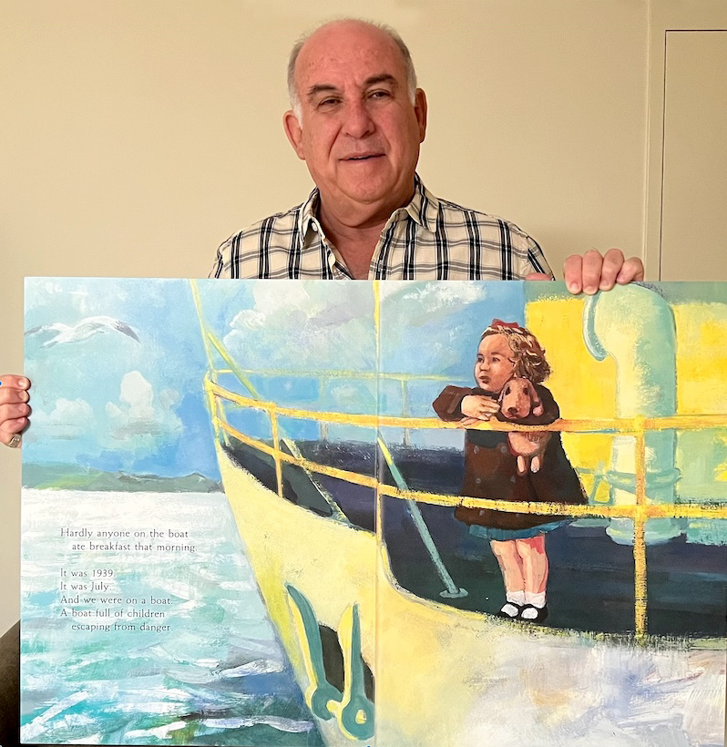 Eli Rabinowitz holding painting of Dorith standing on the bow of a small ship at sea.
